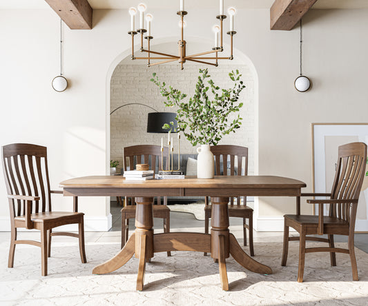 Dining room with wooden table and chairs, chandelier, and decorative elements.
