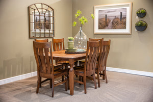 A 6-piece wooden dining room set consisting of a rectangular table and six matching slatted chairs, styled in a dining room corner with a large glass vase, small potted plants, and framed wall art.