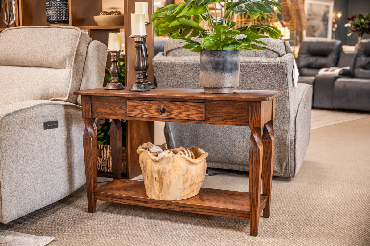 Brantley Sofa Table displayed behind a chair